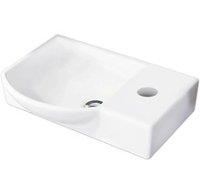 Lave-mains blanc en céramique avec trou de robinetterie à droite et bonde centrale.