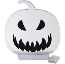 Décoration d'Halloween LED en forme de citrouille en plastique avec un visage noir, un socle blanc et un compartiment à piles.