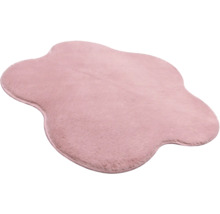 Rosa Kunstfellteppich in unregelmäßiger Wolkenform, weich und flauschig.