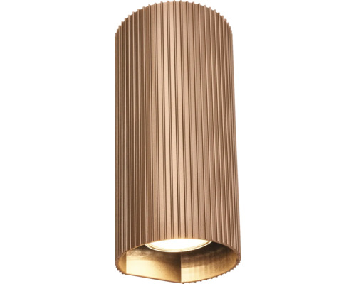 Applique murale extérieure cylindrique avec corps métallique strié aspect bronze, diffusion de la lumière vers le bas.