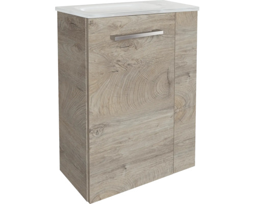 Wandhängender Waschtischunterschrank in Eichenoptik mit weißem Waschbecken und silbernem Griff.