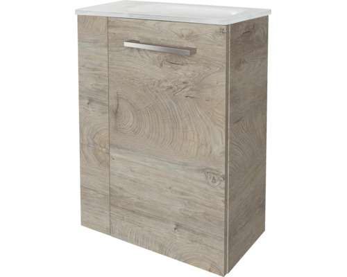 Meuble sous-vasque aspect bois avec lavabo blanc et poignée métallique.
