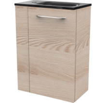Meuble sous-vasque aspect bois avec lavabo noir intégré et poignée argentée.