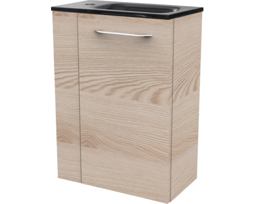 Meuble sous-vasque aspect bois avec lavabo noir intégré et poignée argentée.