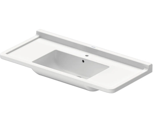 Lavabo rectangulaire blanc en céramique avec larges plages latérales, trop-plein et trou pour robinet.