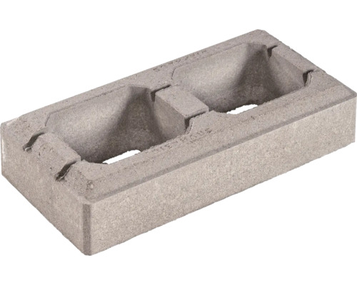 Bloc de coffrage en béton avec deux ouvertures pour maçonnerie.