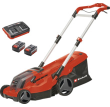 Set tondeuse à gazon sans fil Einhell comprenant deux batteries, un chargeur double et un bac de ramassage.