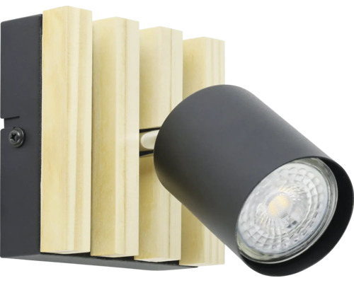 Applique murale avec lamelles en bois clair et un spot orientable en métal noir.