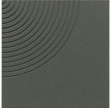 Carreau carré à la texture finement grainée avec un motif décoratif de rainures circulaires concentriques dans un coin.