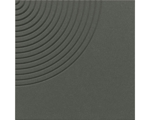 Carreau carré à la texture finement grainée avec un motif décoratif de rainures circulaires concentriques dans un coin.