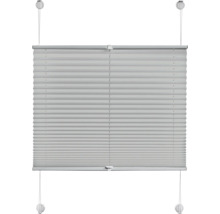 Store plissé tendu pour fenêtres avec deux rails et supports de serrage pour le montage.