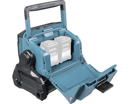 Projecteur de chantier sans fil Makita avec compartiment à batterie ouvert pour deux batteries et poignée