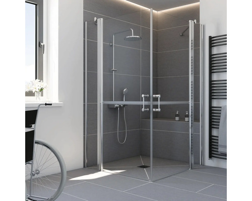 Douche d angle accessible avec portes pliantes, système de douche avec douchette, receveur de douche plain pied et carrelage gris.