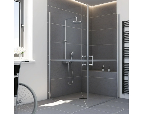Cabine de douche d'angle PMR avec portes vitrées battantes dans une salle de bains moderne en carrelage gris.