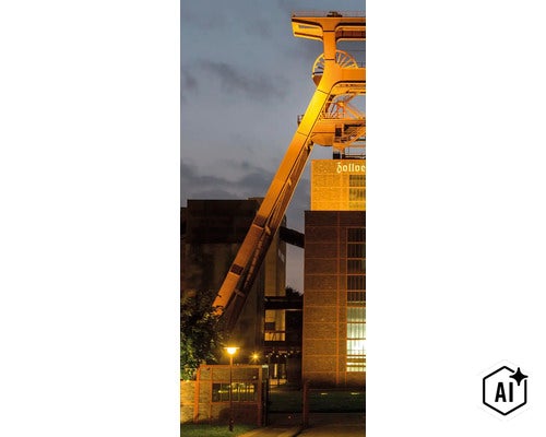 Le chevalement illuminé de la mine Zollverein à Essen au crépuscule. (Image AI modified or generated)