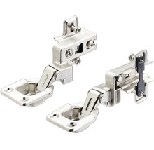 Deux charnières invisibles en métal pour portes de placard avec plaques de montage et vis de réglage pour une fixation facile.