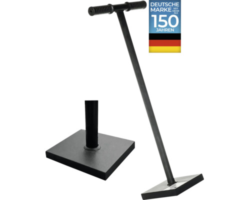 Un pilon en métal avec une plaque de base carrée et une poignée en forme de T avec des grips antidérapants, sceau de qualité marque allemande