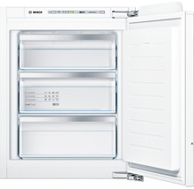 Congélateur intégrable blanc ouvert avec trois tiroirs de congélation et le logo Bosch