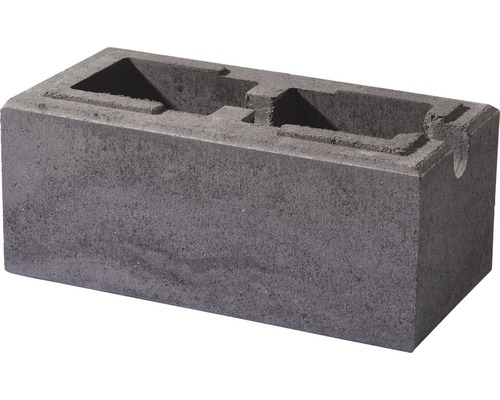 Grauer Mauerstein mit Aussparungen