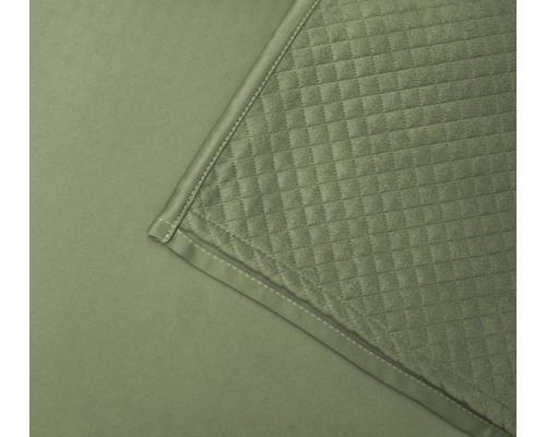 Nahaufnahme einer gesteppten Tagesdecke mit quadratischem Muster