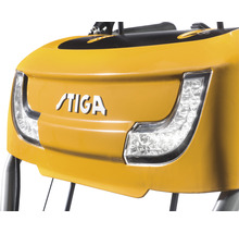 Logo STIGA sur un appareil jaune avec phares