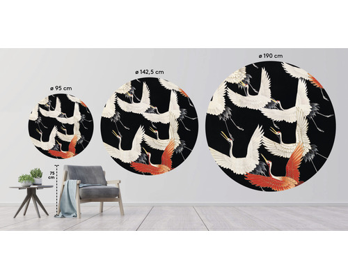 Trois peintures murales rondes avec des motifs de grues de différentes tailles dans un environnement de salon.