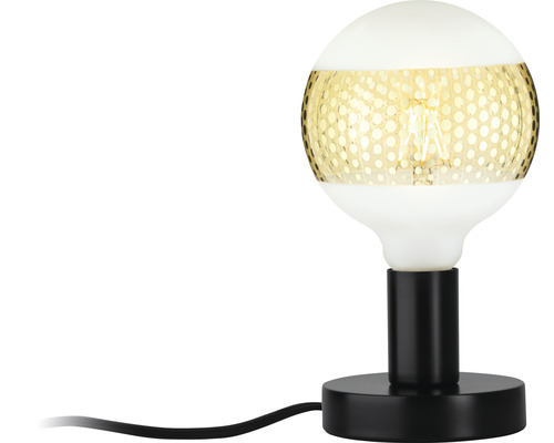 Dekorative Tischleuchte mit einem runden Lampenschirm und einem schwarzen Fuß