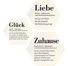 Dekorative Holzschilder mit den Wörtern Glück, Liebe und Zuhause