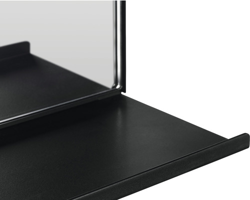 Vue détaillée d''un miroir mural noir avec étagère