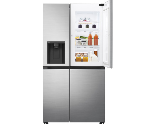 Réfrigérateur en plusieurs parties avec machine à glaçons et porte ouverte, rempli de nourriture.