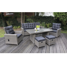 Ensemble de meubles de jardin avec canapé, fauteuil, table et tabourets sur une terrasse