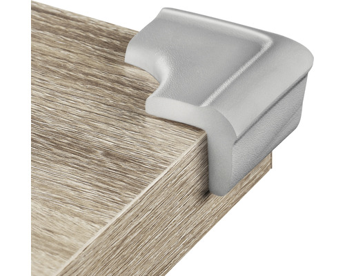 Eckenschutz aus Kunststoff an einer Tischplatte