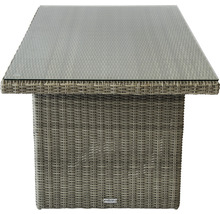 Table de jardin avec plateau en verre et structure en rotin