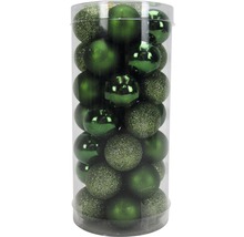 Verpackung mit grünen Weihnachtskugeln mit glänzender und glitzernder Oberfläche