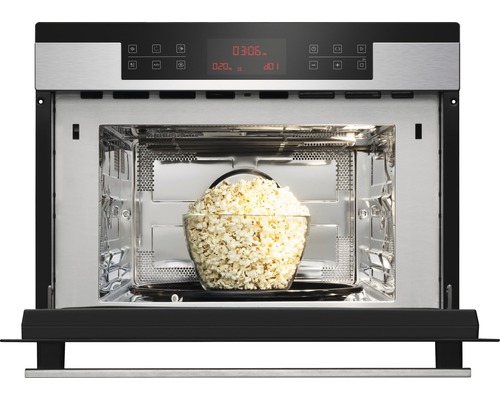 Micro-ondes ouvert avec un bol de pop-corn à l''intérieur