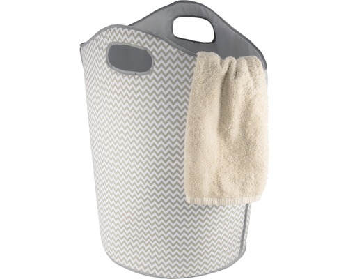 Panier à linge avec motif en zigzag et serviette