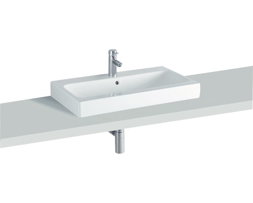 Weißes Aufsatzwaschbecken mit Armatur und Ablauf auf einer Konsole