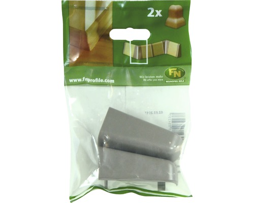 Deux coins pour plinthes dans un emballage