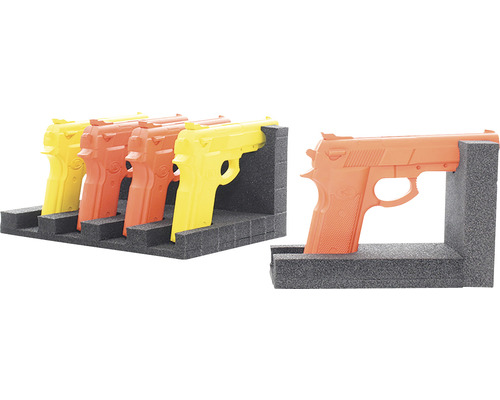 Mehrfarbige Übungswaffen in einer Schaumstoffhalterung