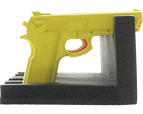 Gelbe Übungspistole im Schaumstoffhalter