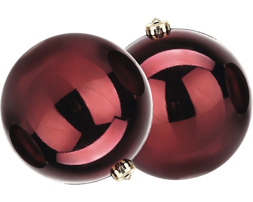 Deux boules de Noël rouges avec des attaches dorées