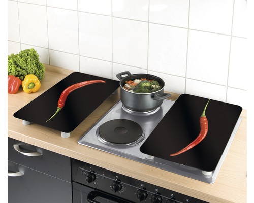 Plaques de recouvrement de cuisinière avec motif de piment sur une plaque de cuisson dans la cuisine