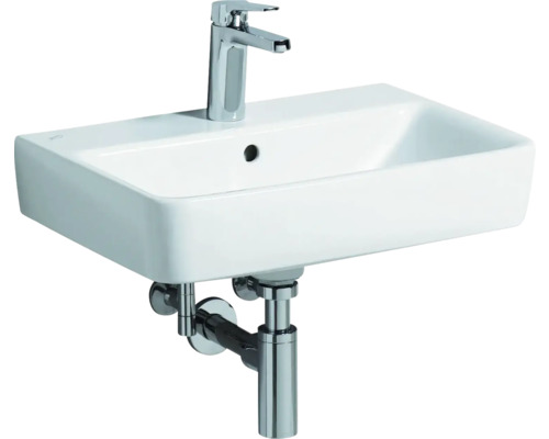 Lavabo blanc avec robinet et siphon pour la salle de bain.