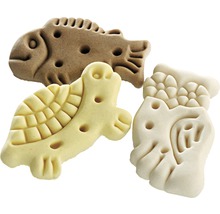 Hundekuchen in Form von Fisch, Schildkröte und Vogel