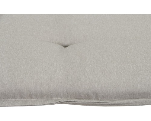 Gros plan d''un coussin d''assise beige avec bouton