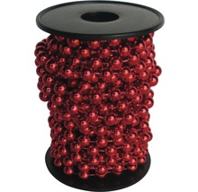 Dekokette mit roten Perlen auf einer schwarzen Spule