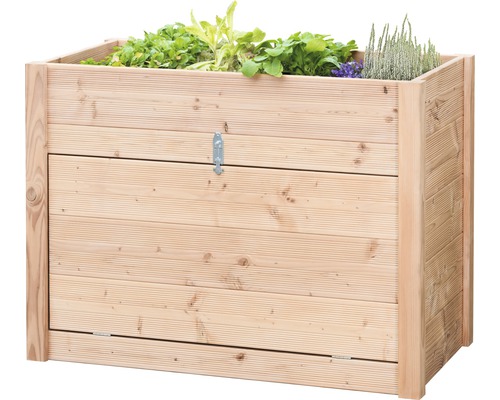 Jardinière surélevée en bois avec plantes et porte verrouillable.