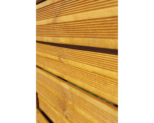 Gros plan d''un élément de clôture en lattes de bois