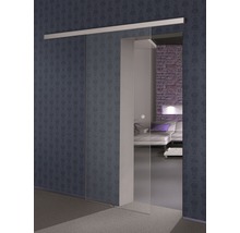 Vue d''une pièce avec porte coulissante en verre devant un mur à motifs