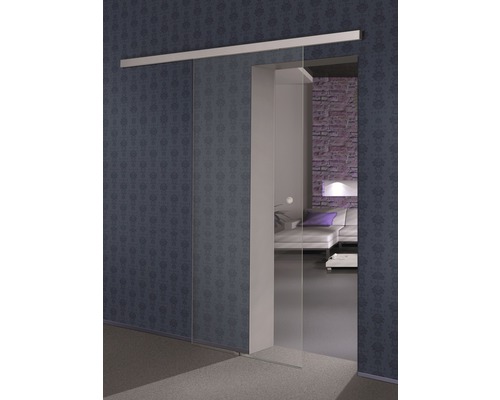 Vue d''une pièce avec porte coulissante en verre devant un mur à motifs